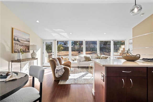 living area featuring dark wood finished floors and recessed lighting