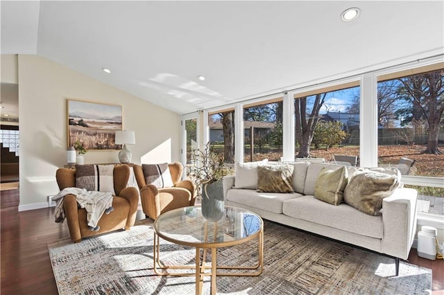 living area with baseboards, recessed lighting, vaulted ceiling, and wood finished floors