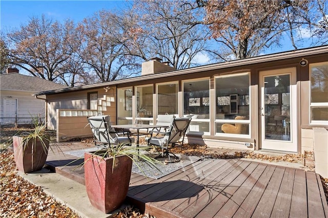 deck with outdoor dining area