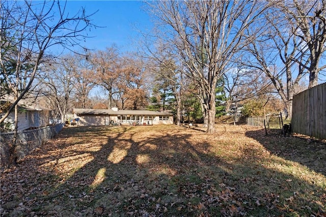view of yard featuring fence