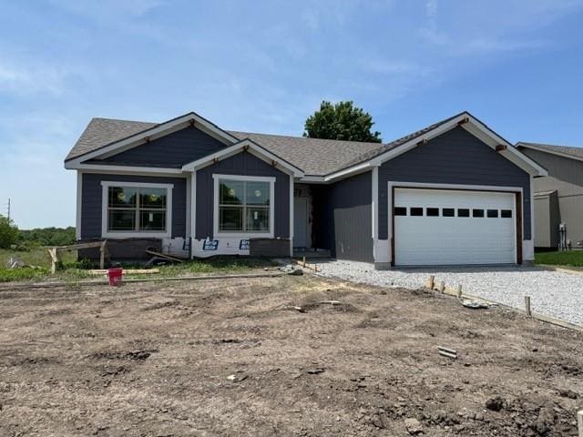 805 Timberline Dr, Cameron, MO 64429 - ranch-style house with an attached garage, driveway, and roof with shingles