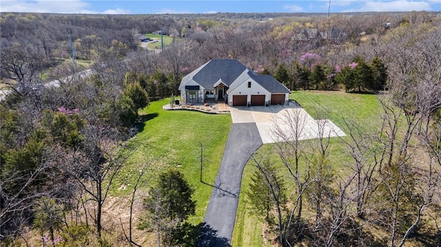 bird's eye view with a forest view
