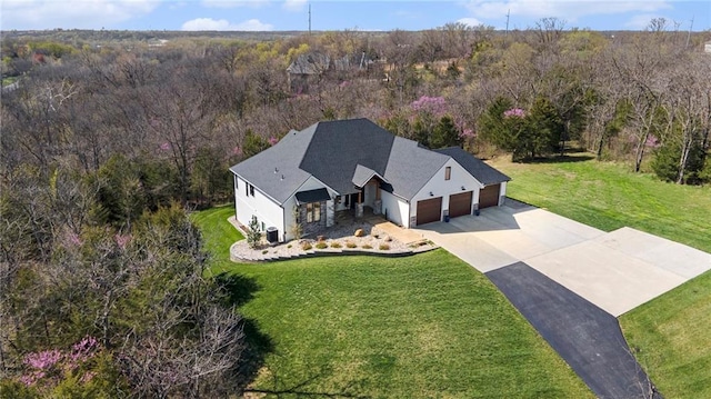 aerial view featuring a wooded view
