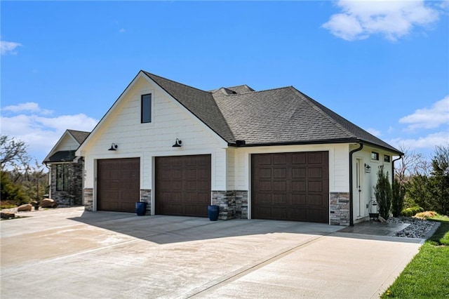 view of property exterior featuring driveway, a shingled roof, and stone siding