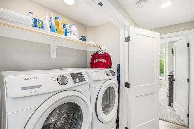 laundry area featuring laundry area, recessed lighting, wood finished floors, and washer and dryer