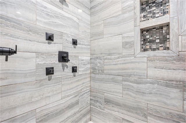 bathroom with tiled shower