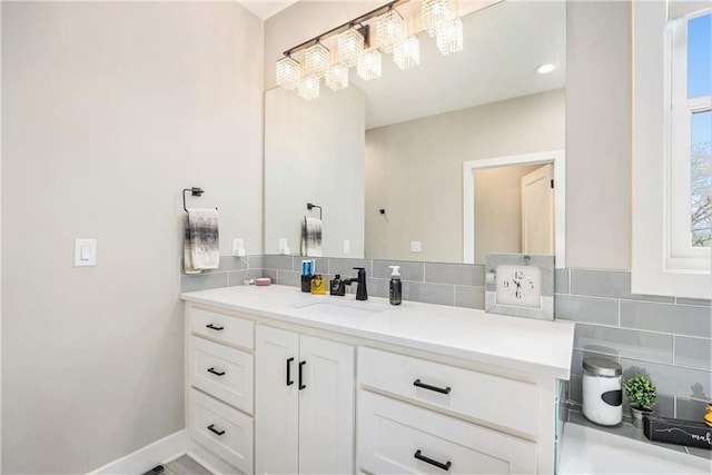 bathroom with backsplash and vanity