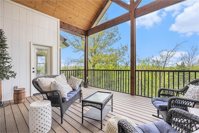 wooden terrace with an outdoor hangout area