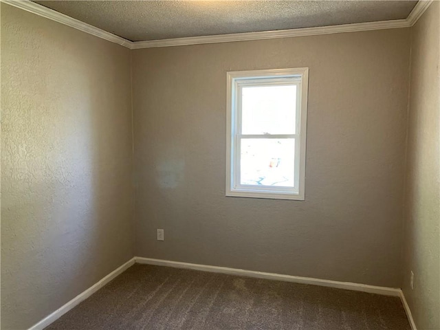 empty room with dark carpet, baseboards, a textured ceiling, and ornamental molding