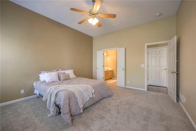 bedroom with carpet flooring, vaulted ceiling, and baseboards