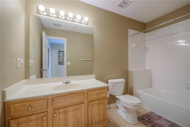 bathroom featuring tile patterned floors, visible vents, toilet, and vanity