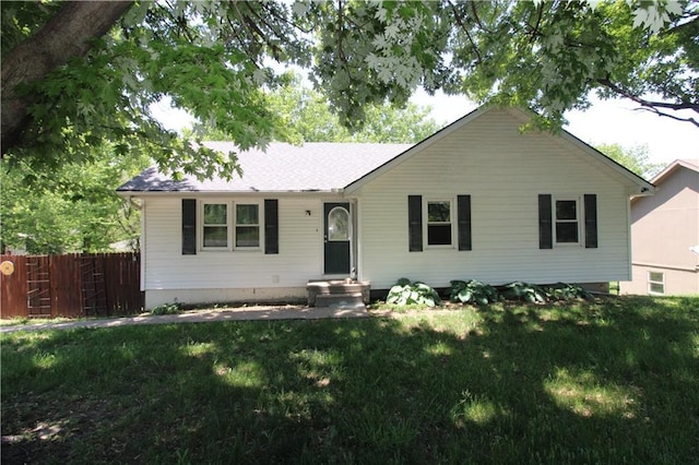 ranch-style house with a shingled roof