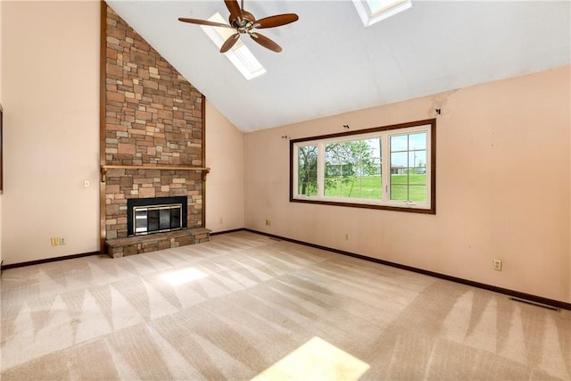 32832 195th St, Leavenworth, KS 66048 - unfurnished living room featuring a skylight, ceiling fan, carpet floors, a fireplace, and high vaulted ceiling