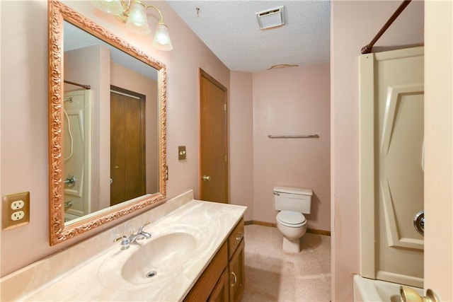 32832 195th St, Leavenworth, KS 66048 - full bath with a textured ceiling, toilet, vanity, and baseboards