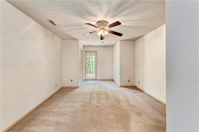 32832 195th St, Leavenworth, KS 66048 - empty room with carpet floors, a ceiling fan, a textured ceiling, and baseboards