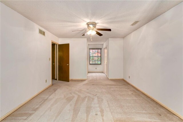 32832 195th St, Leavenworth, KS 66048 - carpeted empty room with ceiling fan, a textured ceiling, and baseboards