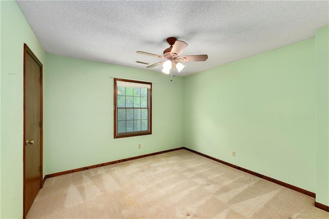 32832 195th St, Leavenworth, KS 66048 - empty room featuring light colored carpet, a ceiling fan, baseboards, and a textured ceiling