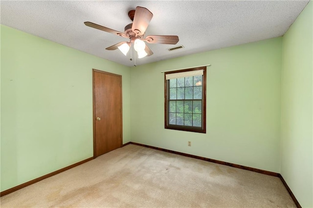 32832 195th St, Leavenworth, KS 66048 - unfurnished room with light colored carpet, baseboards, ceiling fan, and a textured ceiling