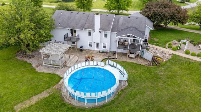 15404 NE 181st St, Holt, MO 64048 - back of house featuring a deck, a chimney, and a lawn