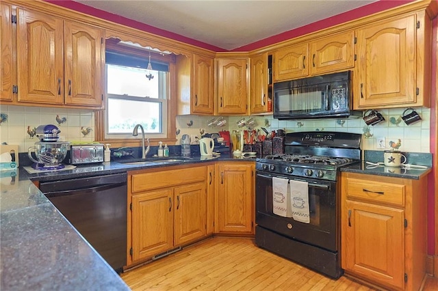 15404 NE 181st St, Holt, MO 64048 - kitchen featuring black appliances, a sink, backsplash, and brown cabinetry
