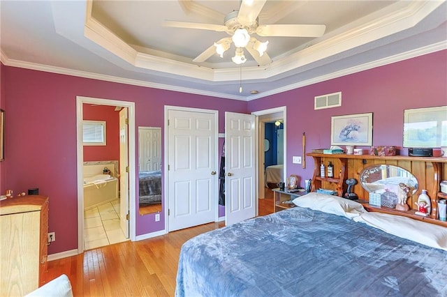 15404 NE 181st St, Holt, MO 64048 - bedroom featuring a raised ceiling, ornamental molding, wood finished floors, ceiling fan, and connected bathroom
