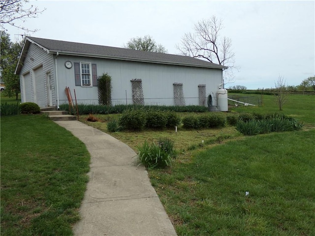 15404 NE 181st St, Holt, MO 64048 - view of side of home featuring a lawn and a garage