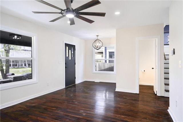 3009 Campbell St, Kansas City, MO 64109 - entryway featuring wood finished floors, ceiling fan with notable chandelier, baseboards, and recessed lighting