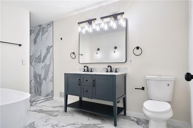 3009 Campbell St, Kansas City, MO 64109 - bathroom with a sink, toilet, double vanity, a marble finish shower, and marble finish floor