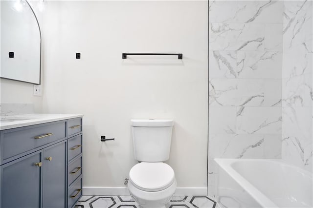 3009 Campbell St, Kansas City, MO 64109 - bathroom with toilet, baseboards, and vanity