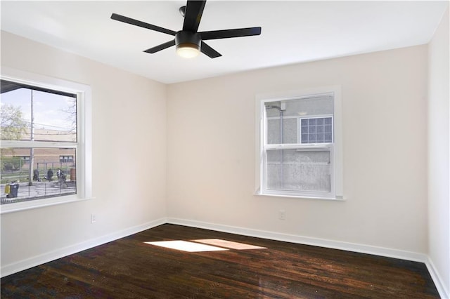 3009 Campbell St, Kansas City, MO 64109 - unfurnished room with wood finished floors, baseboards, and a ceiling fan