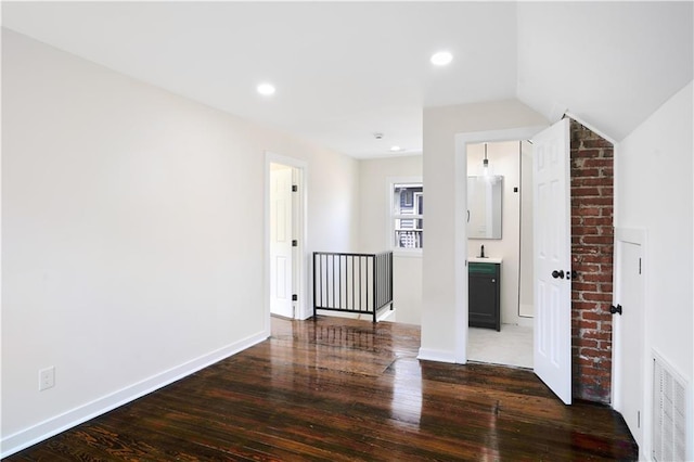 3009 Campbell St, Kansas City, MO 64109 - unfurnished room featuring visible vents, recessed lighting, wood-type flooring, a sink, and baseboards