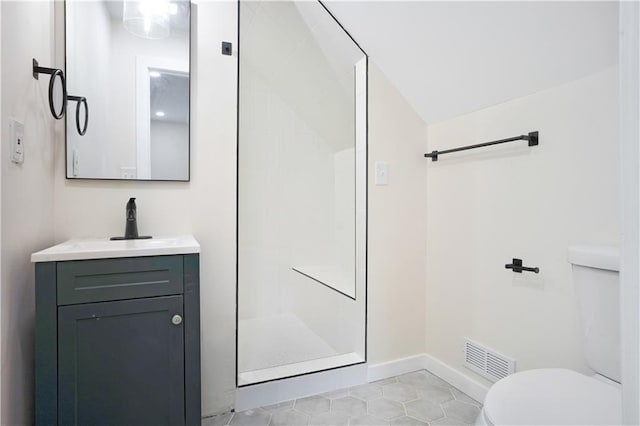 3009 Campbell St, Kansas City, MO 64109 - full bath with toilet, vanity, a shower stall, and visible vents