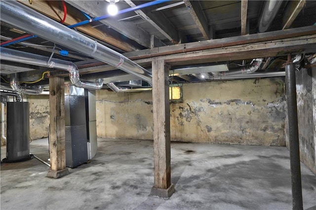 3009 Campbell St, Kansas City, MO 64109 - unfinished basement featuring water heater and heating unit