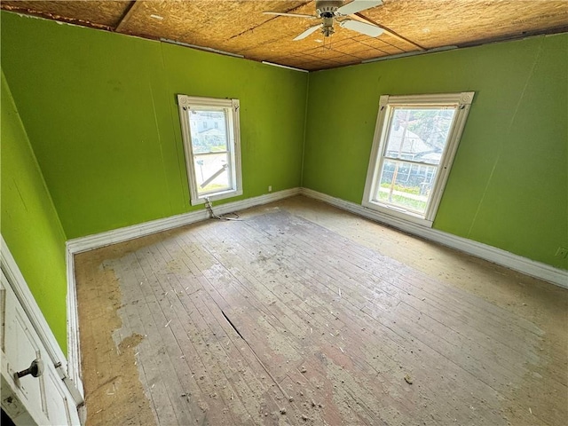 1353 SW Western Ave, Topeka, KS 66604 - empty room with a ceiling fan, baseboards, and light wood-style floors