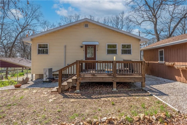 rear view of property with a wooden deck