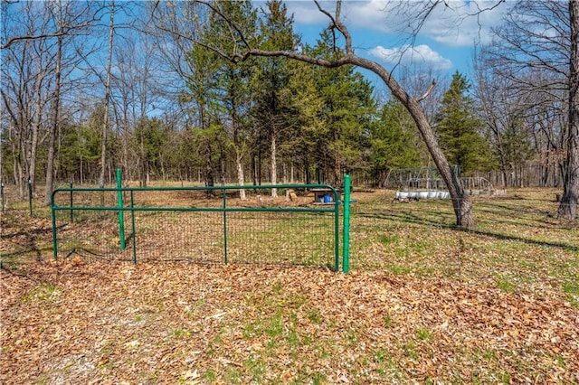 view of home's community featuring fence