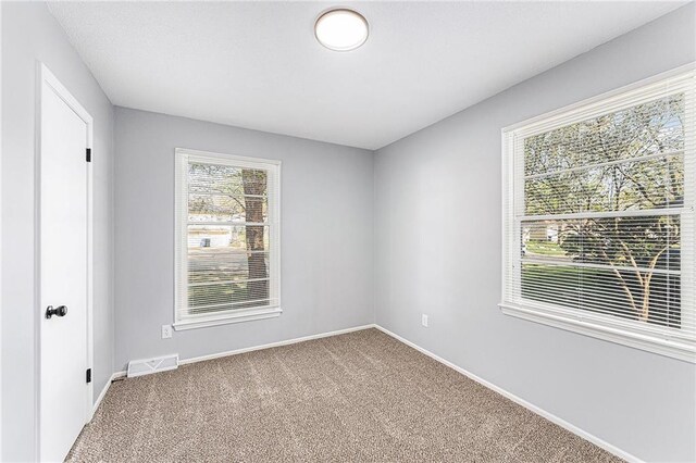 710 N Redwood Dr, Independence, MO 64056 - carpeted spare room with baseboards and visible vents
