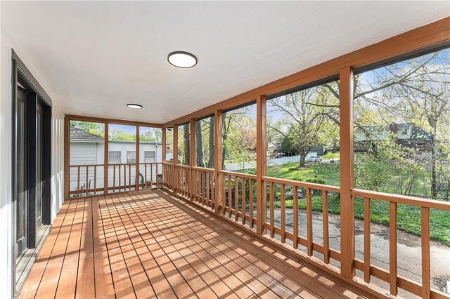 710 N Redwood Dr, Independence, MO 64056 - unfurnished sunroom featuring a water view and a healthy amount of sunlight