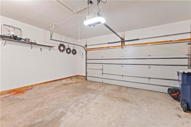 garage with baseboards and a garage door opener
