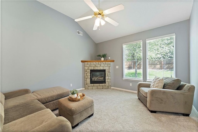 living area with visible vents, baseboards, a ceiling fan, carpet flooring, and a glass covered fireplace