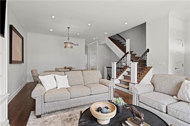 4924 Central St, Kansas City, MO 64112 - living area with recessed lighting, stairway, wood finished floors, crown molding, and a chandelier