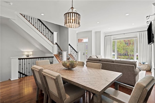 4924 Central St, Kansas City, MO 64112 - dining room with recessed lighting, wood finished floors, stairs, and a notable chandelier
