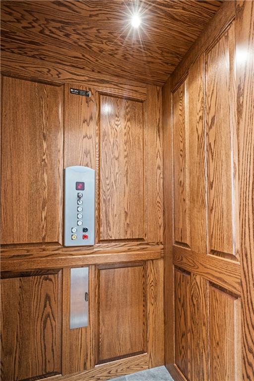 4924 Central St, Kansas City, MO 64112 - interior details with wooden walls and elevator