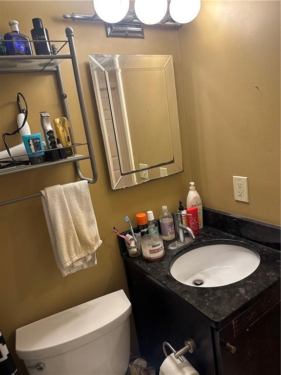 4209 Clark Ave Unit 4209-4, Kansas City, MO 64111 - half bath featuring toilet and vanity