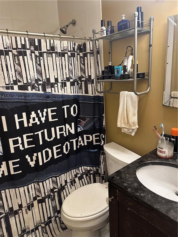 4209 Clark Ave Unit 4209-4, Kansas City, MO 64111 - bathroom with vanity and toilet