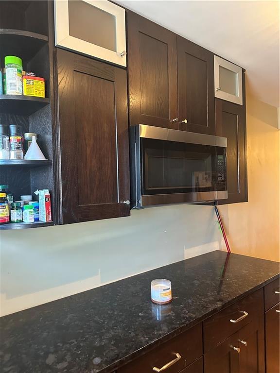 4209 Clark Ave Unit 4209-4, Kansas City, MO 64111 - interior details with stainless steel microwave