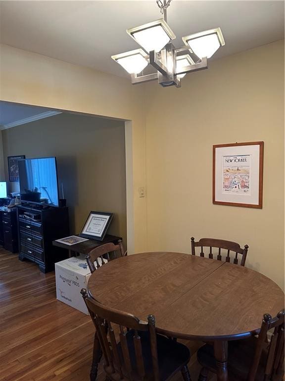 4209 Clark Ave Unit 4209-4, Kansas City, MO 64111 - dining room featuring crown molding and wood finished floors