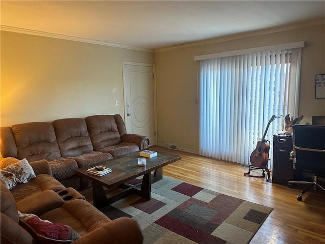4209 Clark Ave Unit 4209-4, Kansas City, MO 64111 - living area featuring visible vents, ornamental molding, baseboards, and wood finished floors
