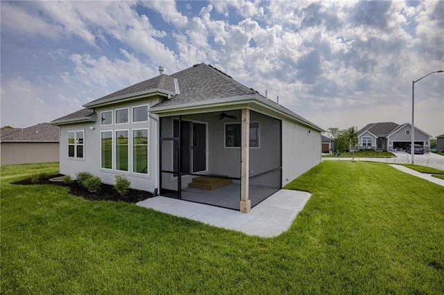 8216 NW 89th Ter, Kansas City, MO 64153 - rear view of property with a yard, a shingled roof, and a ceiling fan
