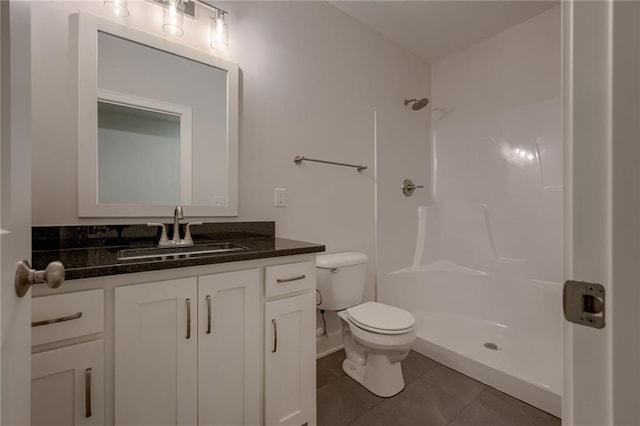 8216 NW 89th Ter, Kansas City, MO 64153 - full bathroom with a shower, tile patterned flooring, vanity, and toilet